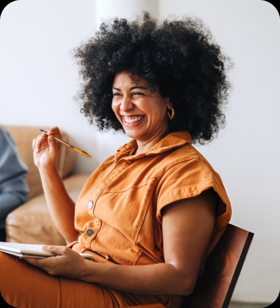 Woman with curly hair laughing